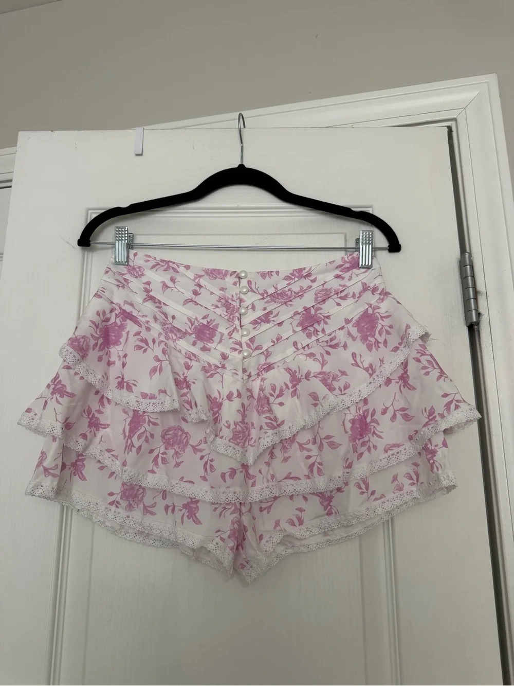 Pink and white floral shorts with lace trim Size M